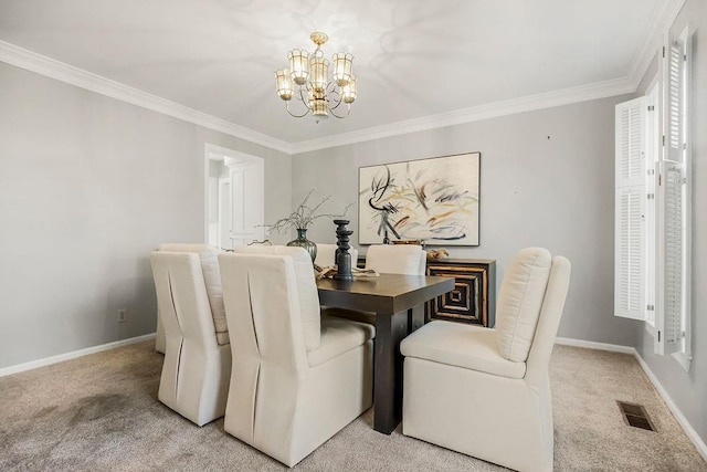 dining area featuring visible vents, baseboards, light colored carpet, and a chandelier