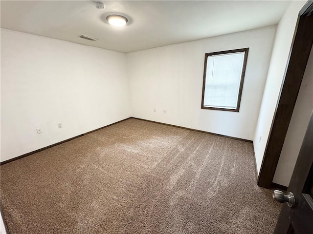 empty room with carpet flooring