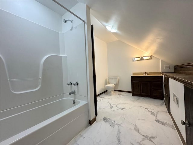 full bathroom featuring  shower combination, vanity, vaulted ceiling, and toilet