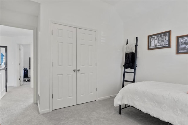 carpeted bedroom featuring a closet