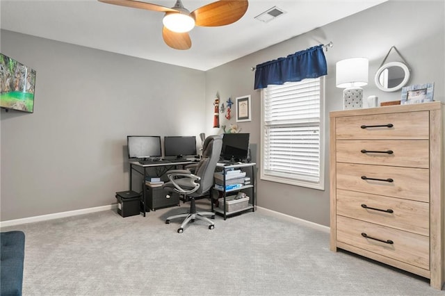 home office featuring light colored carpet and ceiling fan