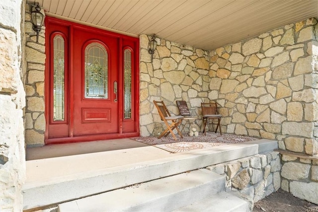 entrance to property featuring a porch