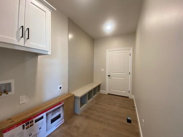 mudroom with baseboards and wood finished floors