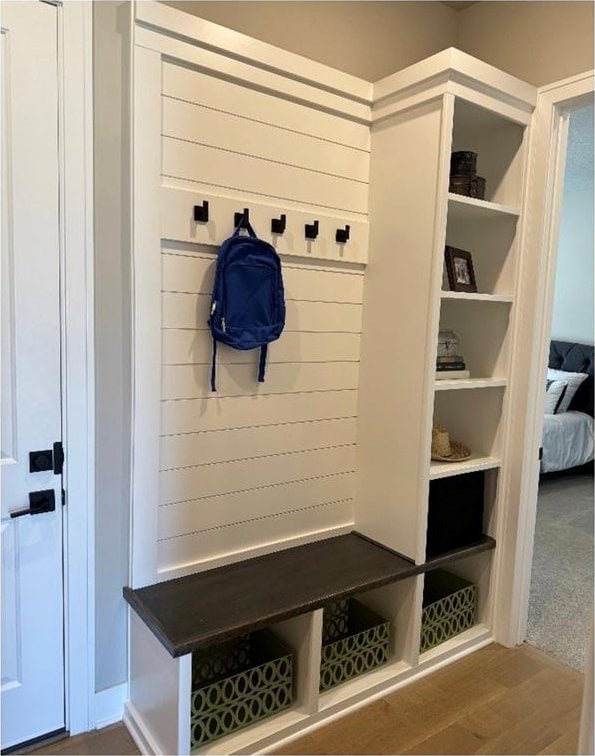 mudroom with wood finished floors