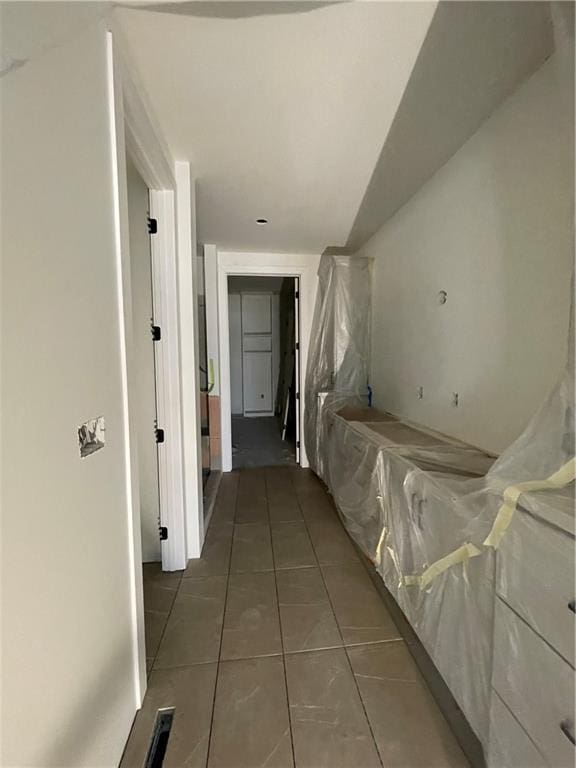 hall featuring tile patterned flooring