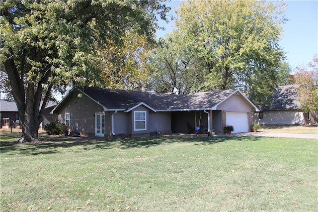 single story home featuring a garage and a front lawn