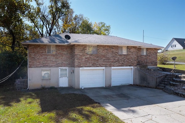 back of house featuring a garage