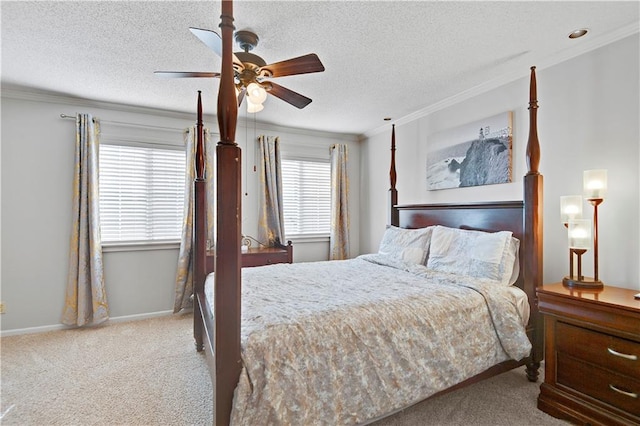 carpeted bedroom featuring crown molding, a textured ceiling, and ceiling fan