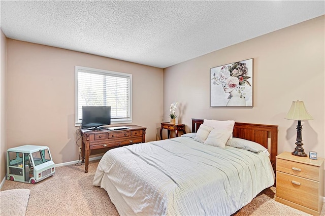 carpeted bedroom featuring a textured ceiling