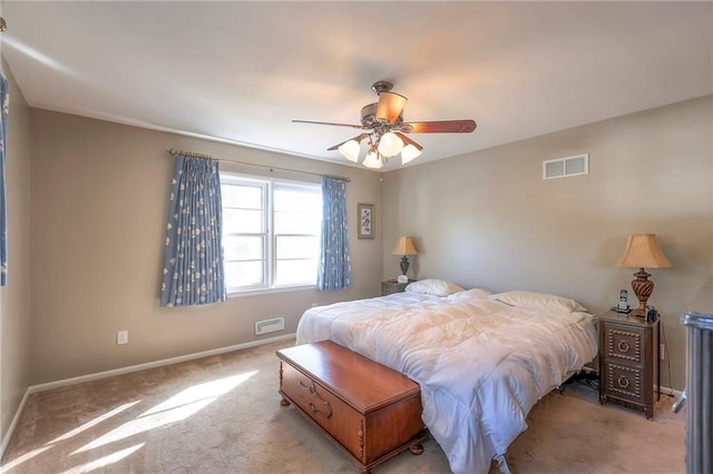 bedroom featuring light carpet and ceiling fan