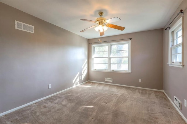 carpeted empty room with ceiling fan