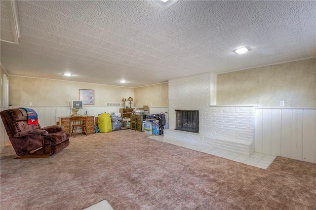 basement with carpet flooring and a fireplace