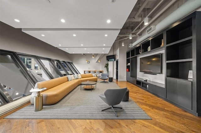 1101 Walnut St Unit 605, Kansas City, MO 64106 - living area with wood finished floors and recessed lighting