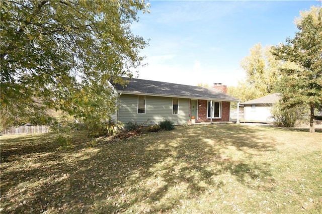 ranch-style house with a front lawn