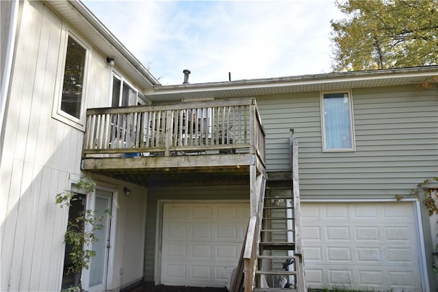 exterior space with a garage and a balcony