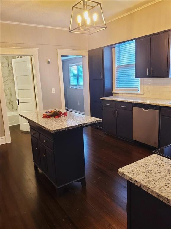 kitchen with dark wood-type flooring, dark brown cabinets, dishwasher, and decorative light fixtures