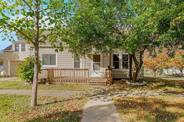 obstructed view of property featuring covered porch and a garage