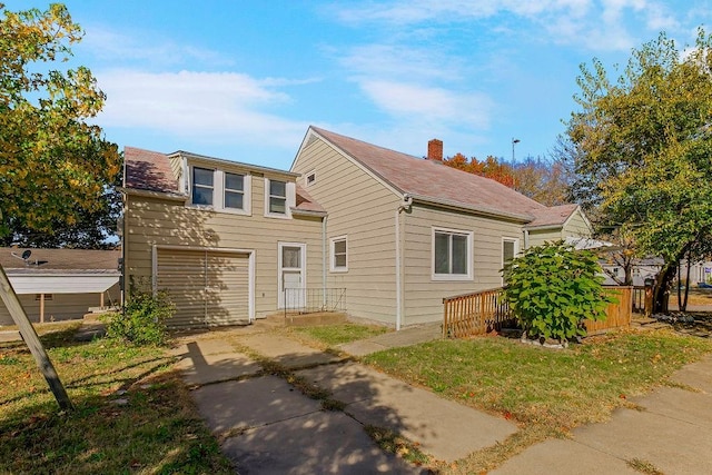 exterior space featuring a garage and a deck