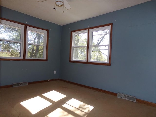 unfurnished room with ceiling fan