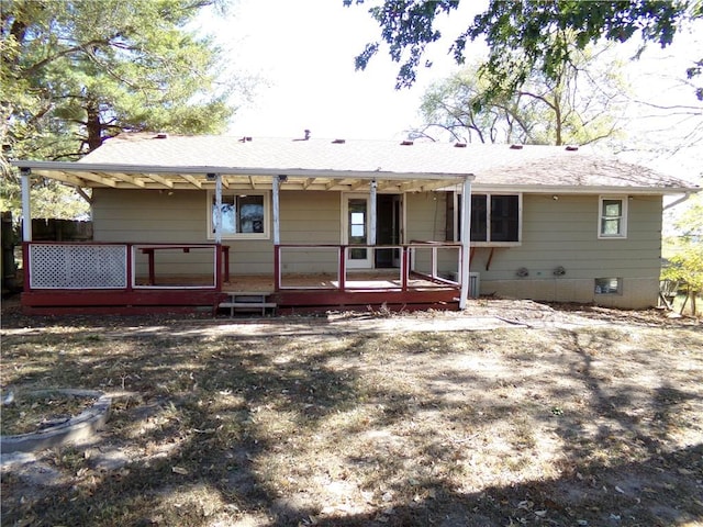 rear view of property with a deck