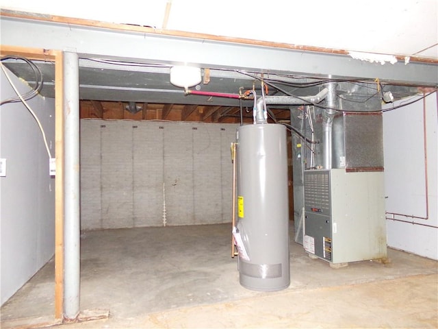 basement with water heater and heating unit