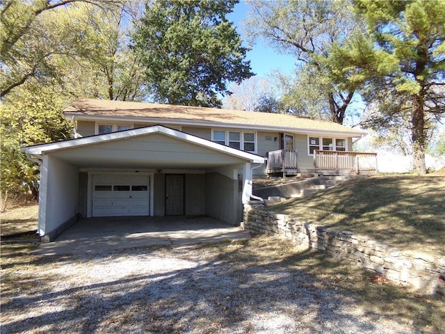 view of front of home featuring a carport, a front yard, and a garage