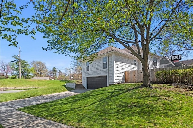 view of home's exterior featuring a yard and a garage