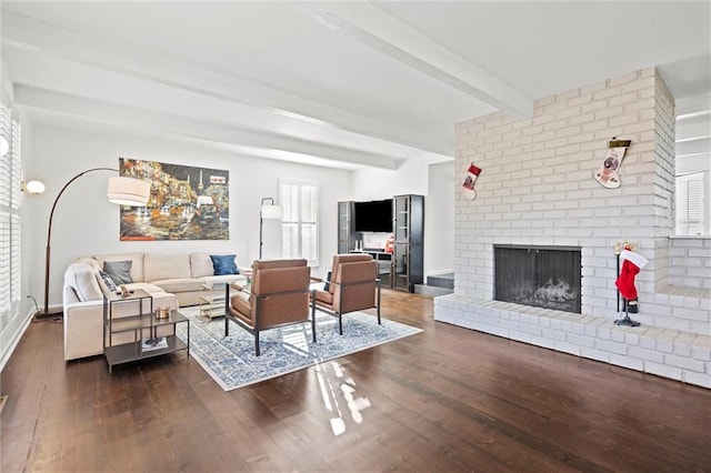 living room with beam ceiling, a fireplace, and dark hardwood / wood-style floors