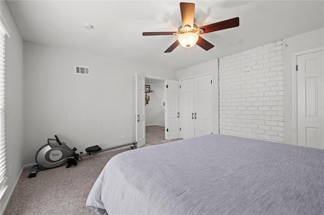 bedroom featuring ceiling fan and light carpet