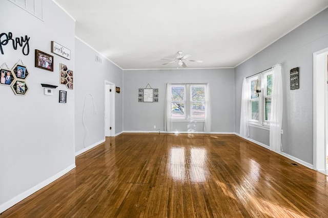 unfurnished room with ornamental molding, hardwood / wood-style floors, and ceiling fan