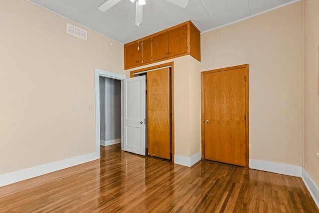 unfurnished bedroom with hardwood / wood-style floors and ceiling fan