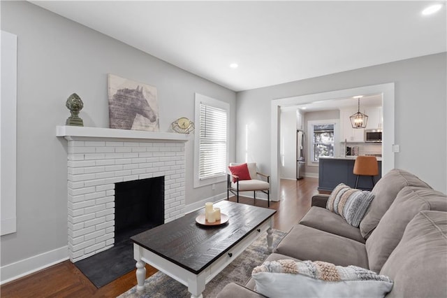 living room with a fireplace and hardwood / wood-style floors