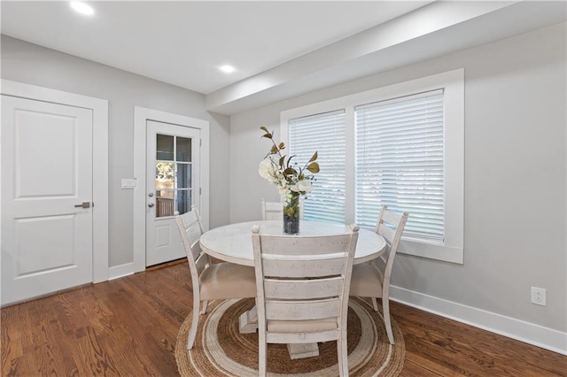 dining room with dark hardwood / wood-style floors and plenty of natural light