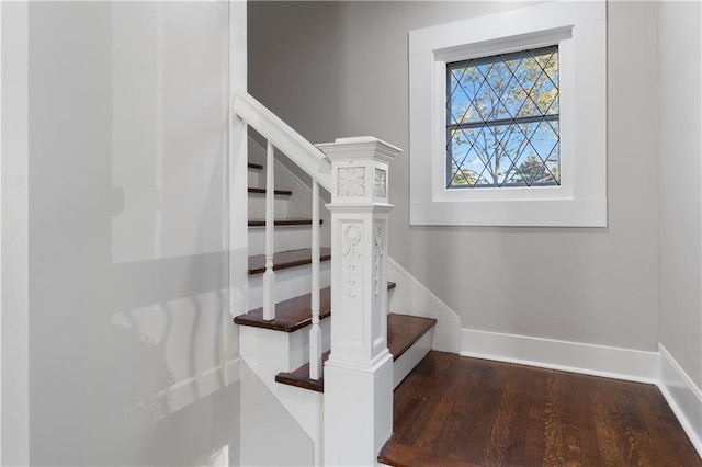 stairs with wood-type flooring