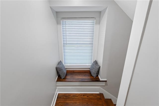 staircase with lofted ceiling and hardwood / wood-style floors