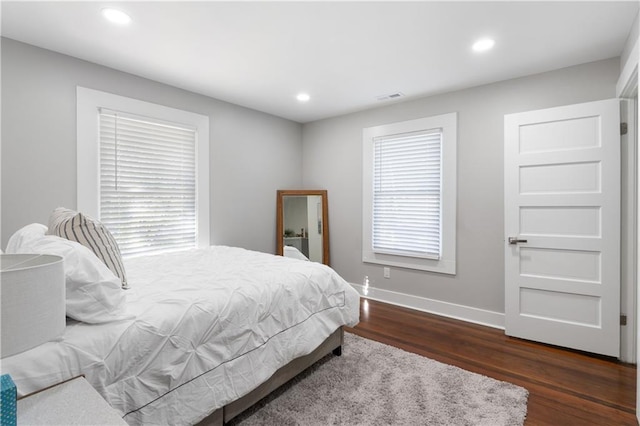 bedroom featuring dark wood-type flooring