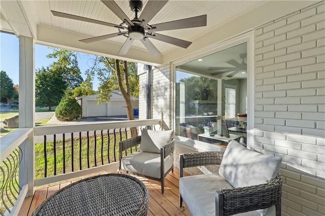 sunroom featuring ceiling fan and a wealth of natural light