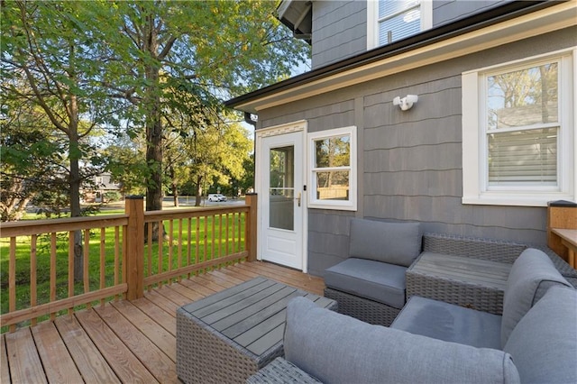 wooden terrace featuring outdoor lounge area