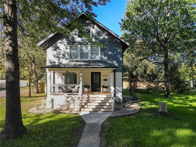 view of front of house featuring a front yard and covered porch