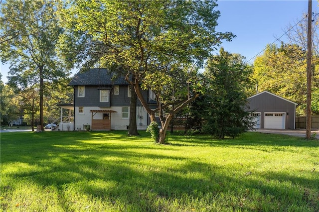 view of front of home with a front lawn and a garage