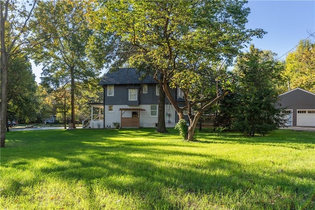 view of yard with an outdoor structure and a garage