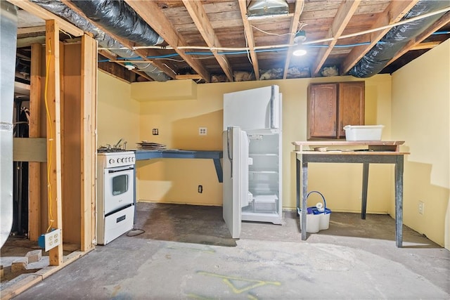 basement with white refrigerator