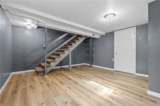 basement featuring hardwood / wood-style floors