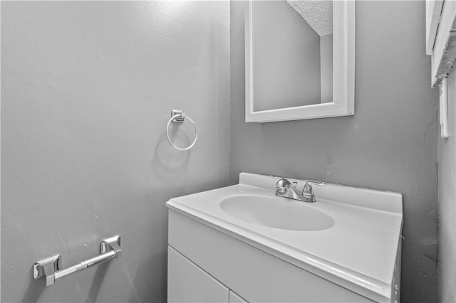 bathroom featuring vanity and a textured ceiling