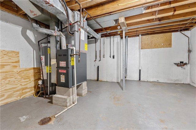 basement with gas water heater and heating unit