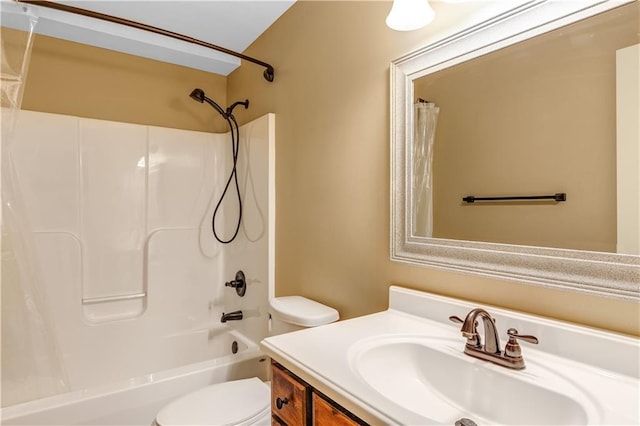 full bathroom with vanity, shower / bath combo with shower curtain, and toilet