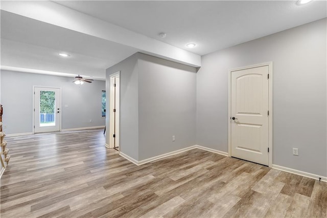 unfurnished room featuring light hardwood / wood-style flooring and ceiling fan