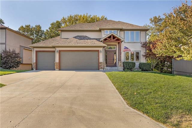 view of front of house featuring a garage and a front lawn