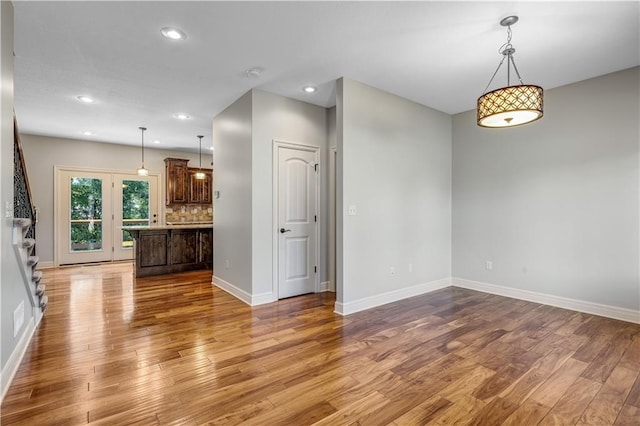 unfurnished living room featuring hardwood / wood-style floors