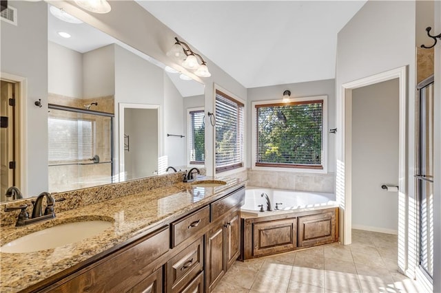 bathroom featuring vanity, tile patterned floors, vaulted ceiling, and separate shower and tub